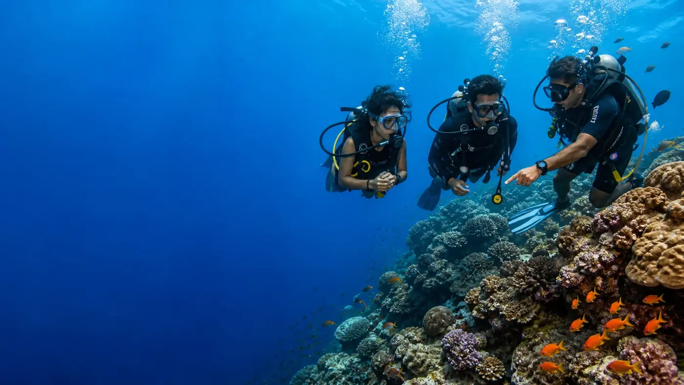 Travellers scuba diving together in clear Andaman waters